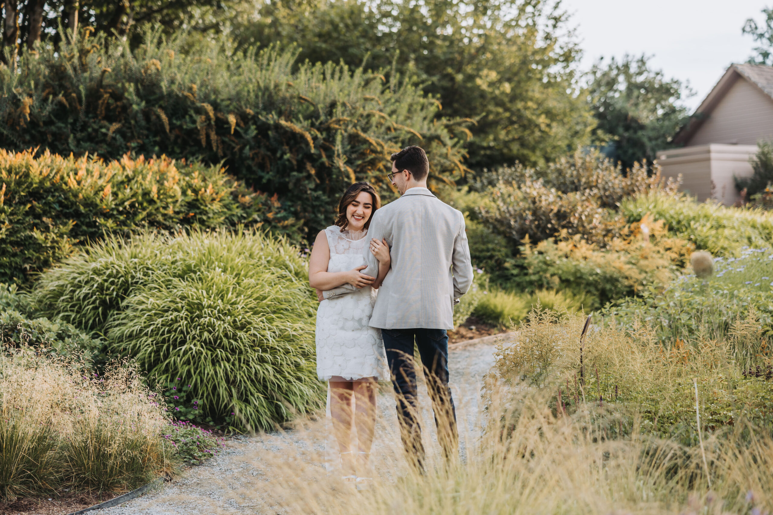 Couple sharing an intimate moment together at Bellevue Botanical Garden in Bellevue, WA