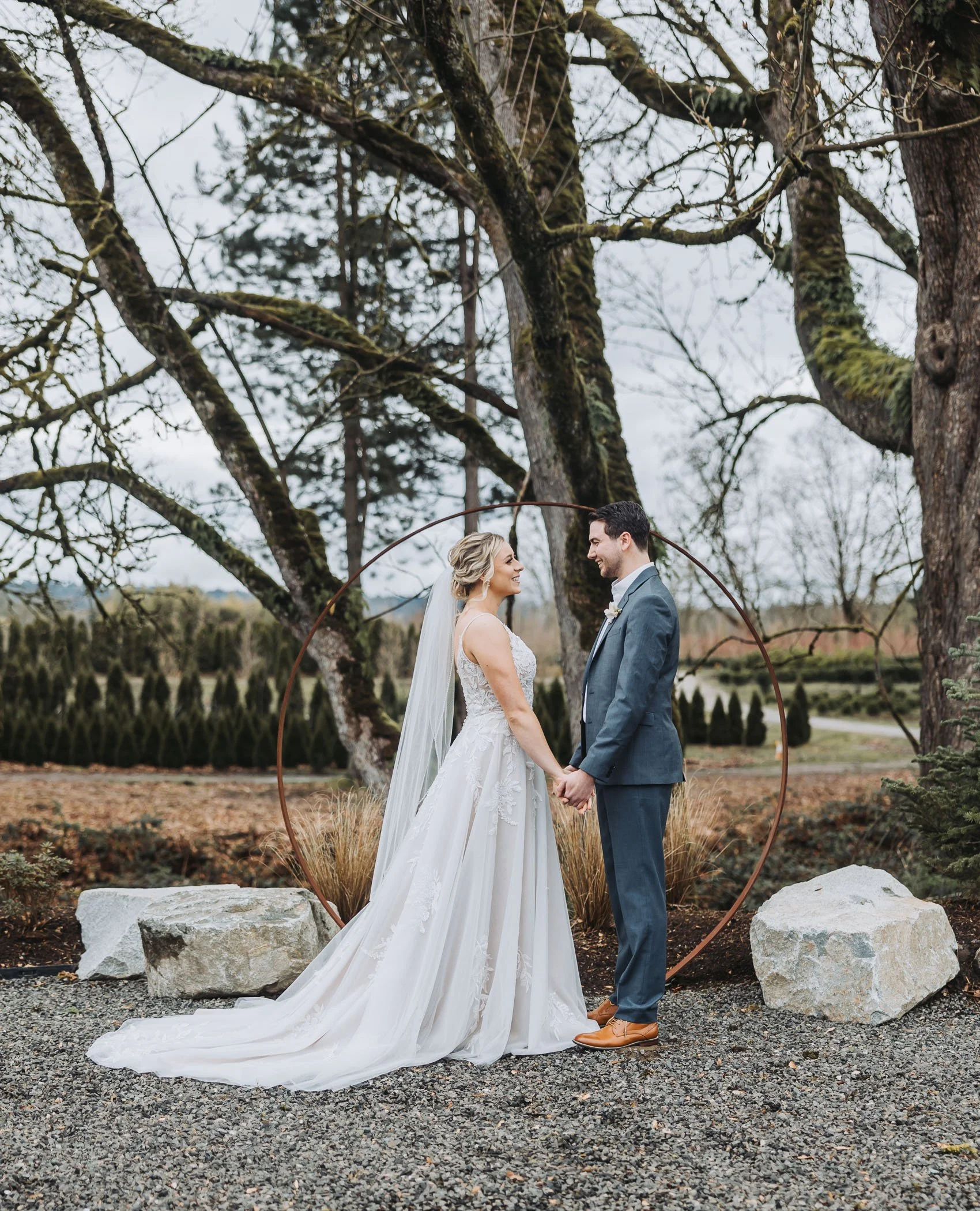 Bride and Groom at the Ceremony Altar at The Grove at West Coast Nursery in Monroe, WA