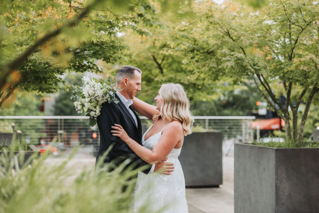Bride and Groom Enjoying a Moment together at Bothell Courthouse in Bothell, Washington after their Courthouse Elopement Ceremony