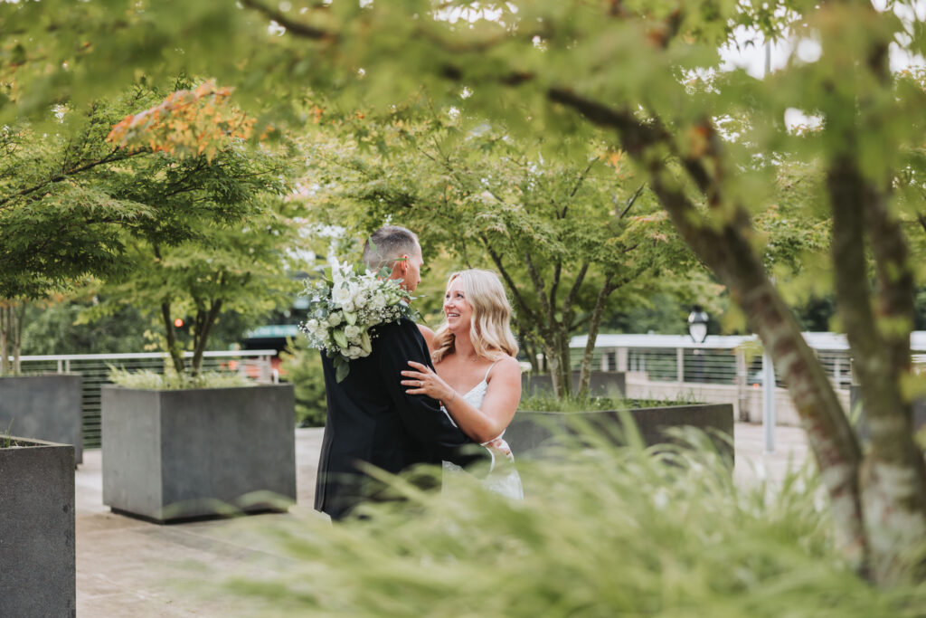 Bride and Groom Enjoying a Moment together at Bothell Courthouse in Bothell, Washington after their Courthouse Elopement Ceremony