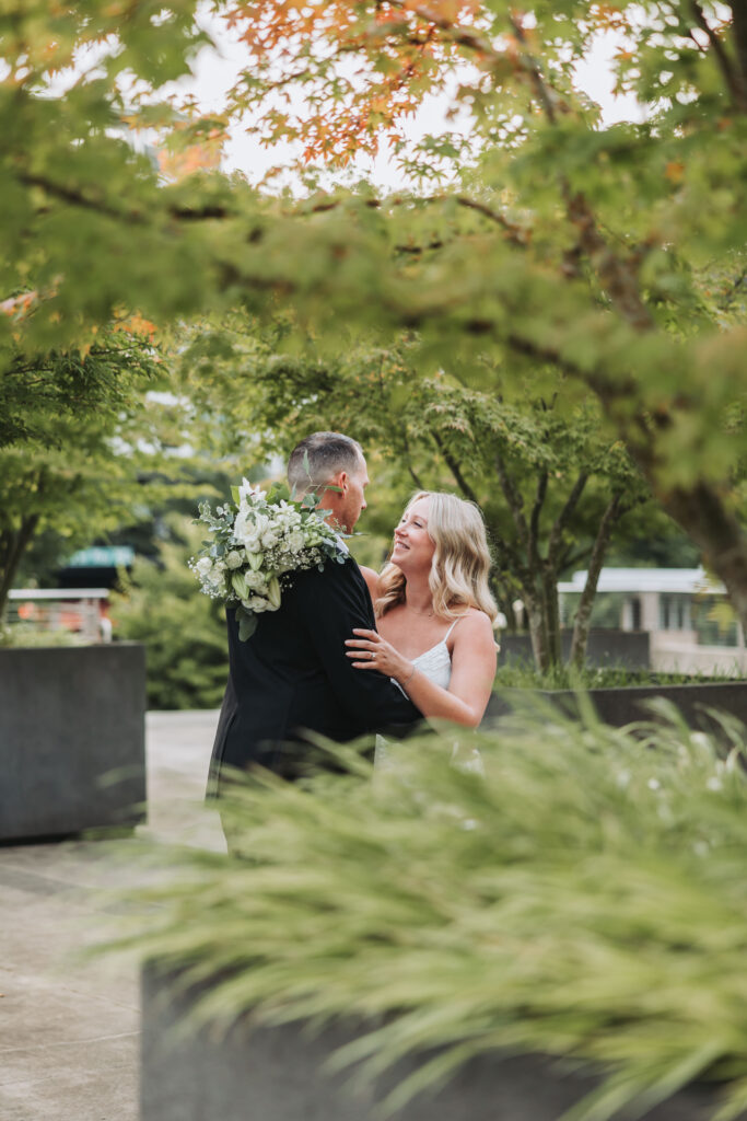 Bride and Groom Enjoying a Moment together at Bothell Courthouse in Bothell, Washington after their Courthouse Elopement Ceremony