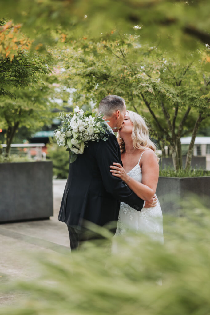 Bride and Groom Enjoying a Moment together at Bothell Courthouse in Bothell, Washington after their Courthouse Elopement Ceremony