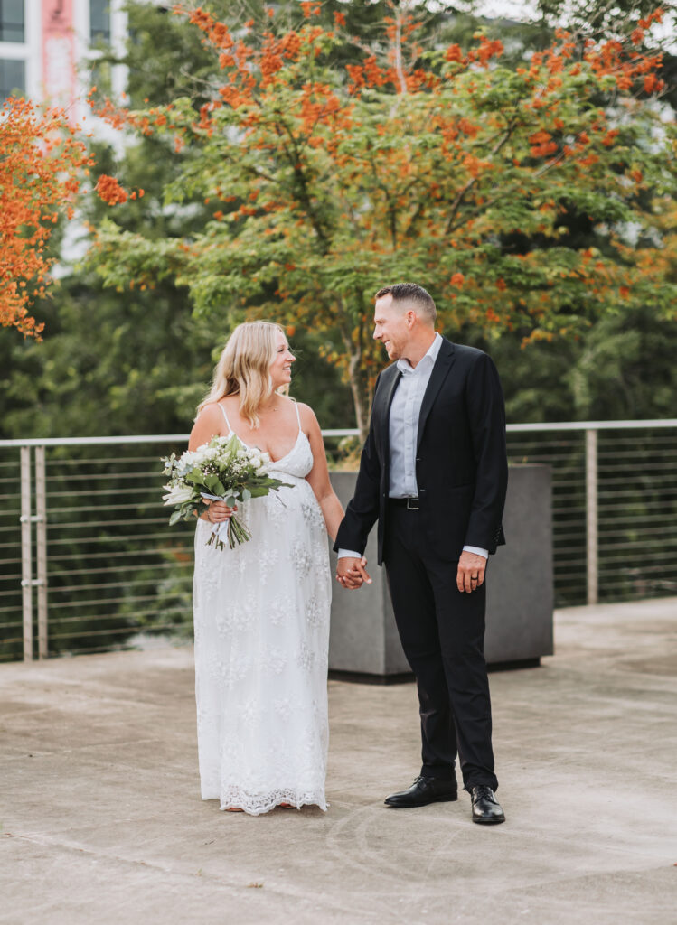 Bride and Groom Enjoying a Moment together at Bothell Courthouse in Bothell, Washington after their Courthouse Elopement Ceremony