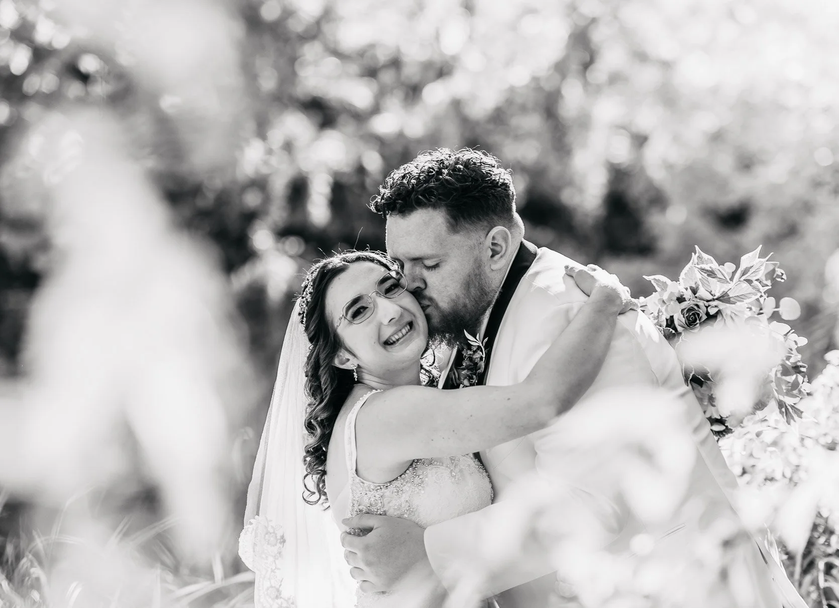 Black and White Photo Bride and Groom enjoying a sweet moment