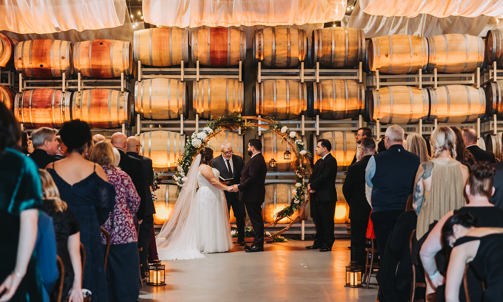 Bride and Groom at their Ceremony in the Barrell Room at Columbia Collective in Woodinville, WA